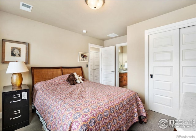 carpeted bedroom with a closet and visible vents