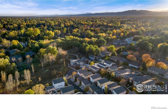 drone / aerial view featuring a residential view and a mountain view