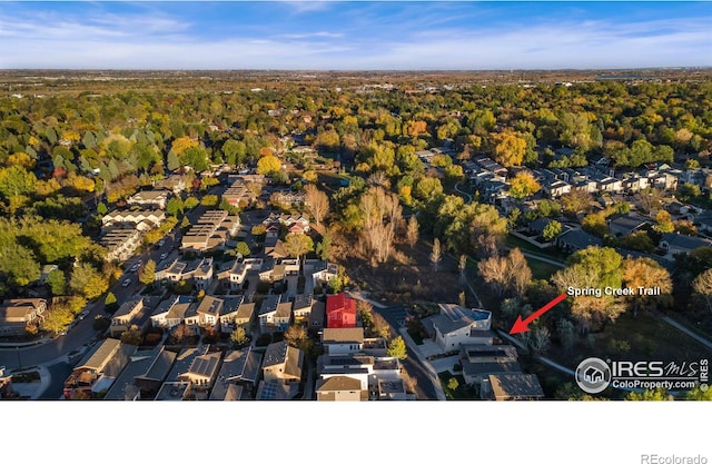 drone / aerial view with a residential view and a forest view