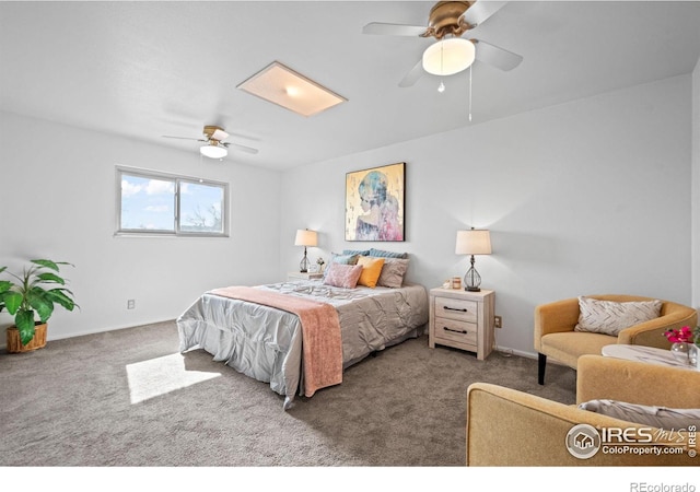 bedroom with ceiling fan, carpet flooring, and baseboards