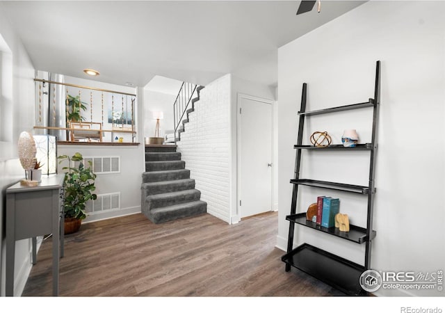 interior space with visible vents and wood finished floors