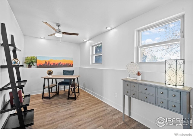 dining space with light wood-type flooring, ceiling fan, baseboards, and recessed lighting