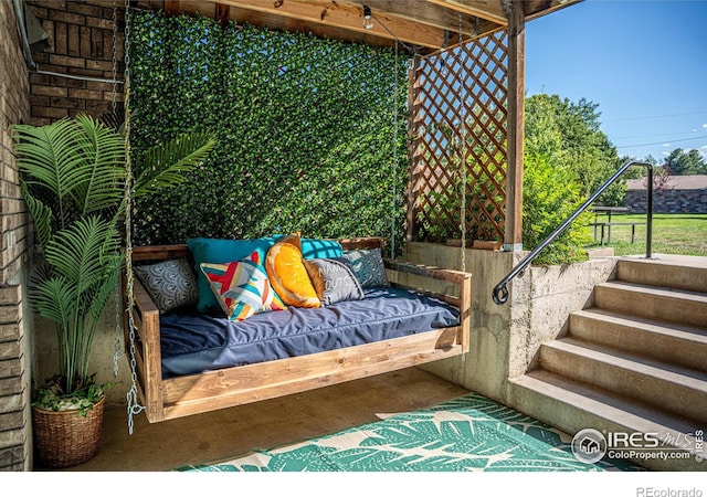 balcony featuring an outdoor hangout area and stairway