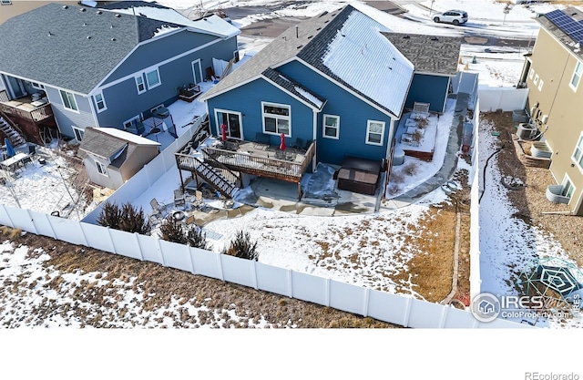 snowy aerial view with a residential view