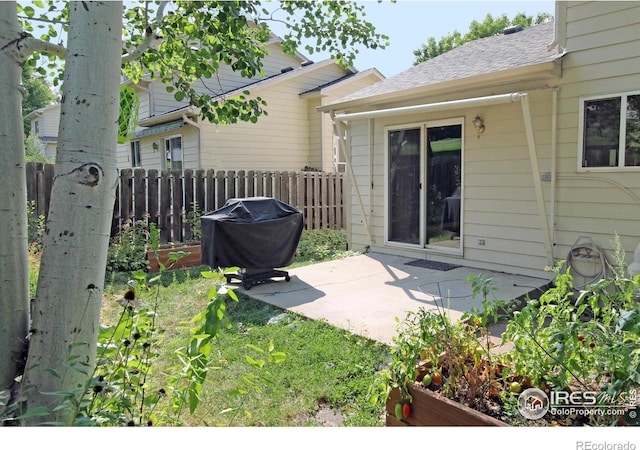 view of patio featuring fence