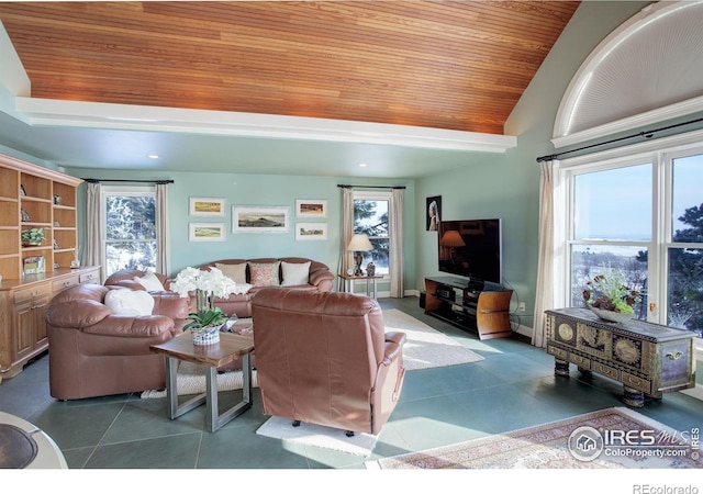 living area featuring vaulted ceiling, dark tile patterned floors, wooden ceiling, and baseboards