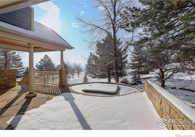 view of yard layered in snow