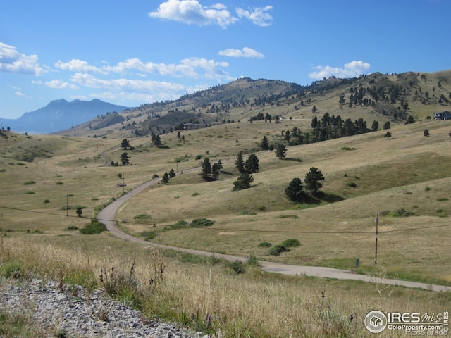 mountain view featuring a rural view