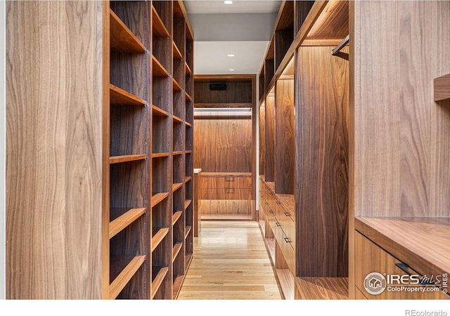 wine area with light wood finished floors and recessed lighting