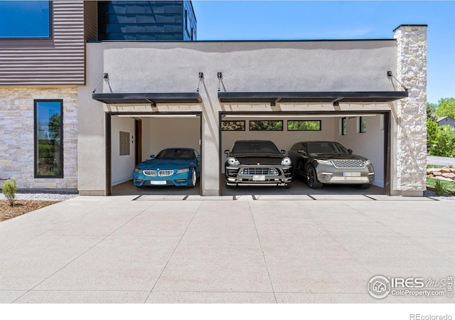 view of car parking featuring concrete driveway