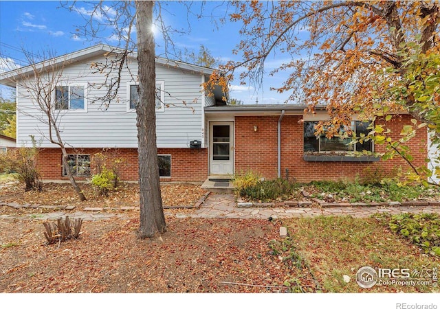 view of front of property featuring brick siding