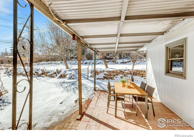 view of snow covered patio