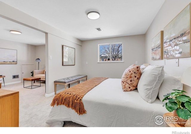 bedroom featuring light carpet, visible vents, and baseboards