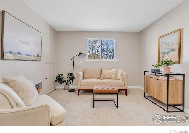 living room with light colored carpet and baseboards