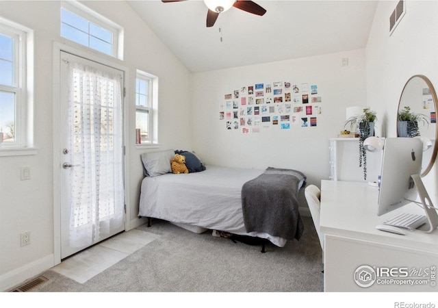 bedroom featuring access to outside, visible vents, vaulted ceiling, and light colored carpet