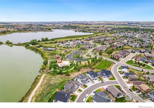 aerial view featuring a water view and a residential view