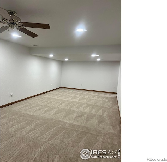 spare room featuring recessed lighting, baseboards, a ceiling fan, and light colored carpet