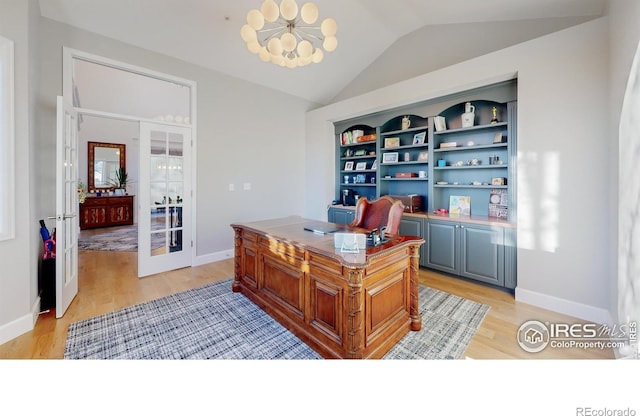 office space with lofted ceiling, french doors, light wood finished floors, and baseboards