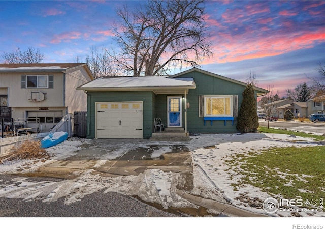 view of front of home with a garage and concrete driveway