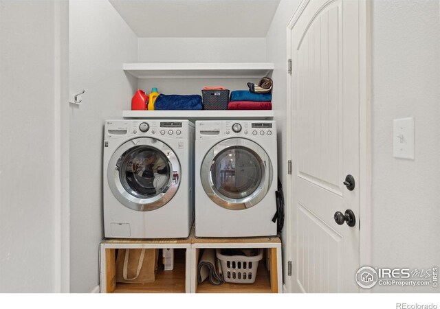 laundry room featuring laundry area and separate washer and dryer