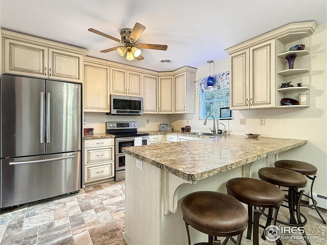 kitchen with stone finish flooring, stainless steel appliances, visible vents, cream cabinetry, and open shelves