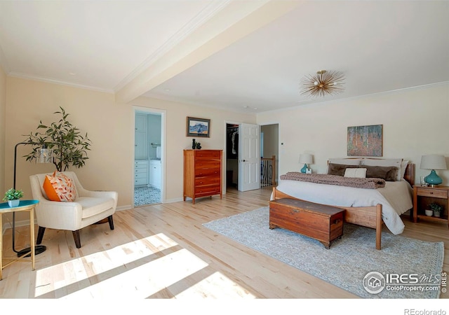 7034 Indian Peaks Trl, Boulder, CO 80301 - bedroom with wood finished floors, crown molding, connected bathroom, baseboards, and a walk in closet