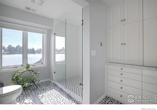 7034 Indian Peaks Trl, Boulder, CO 80301 - full bathroom featuring baseboards, a stall shower, and toilet