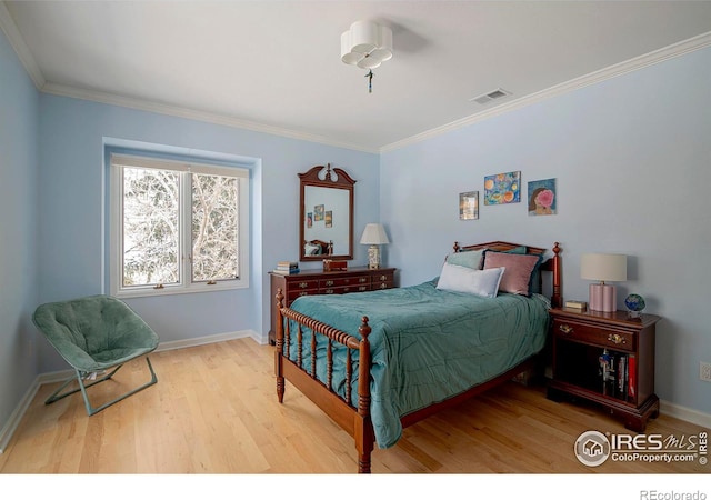 7034 Indian Peaks Trl, Boulder, CO 80301 - bedroom featuring wood finished floors, ornamental molding, and baseboards