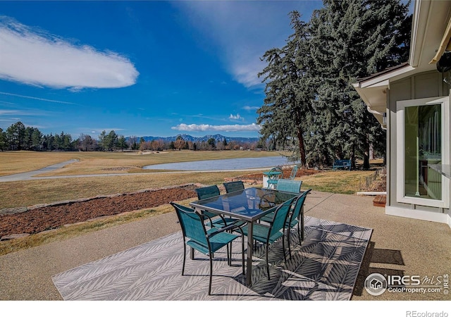 7034 Indian Peaks Trl, Boulder, CO 80301 - view of patio featuring outdoor dining area and a mountain view