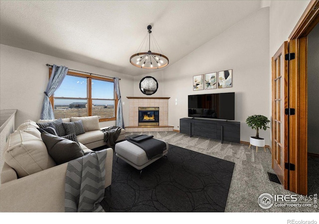 11837 County Road 39, Fort Lupton, CO 80621 - living area with carpet floors, high vaulted ceiling, a chandelier, and a tile fireplace