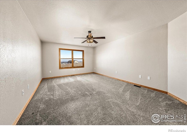 11837 County Road 39, Fort Lupton, CO 80621 - spare room featuring carpet flooring, visible vents, a textured ceiling, and ceiling fan