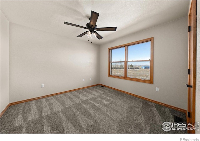11837 County Road 39, Fort Lupton, CO 80621 - carpeted empty room with baseboards, a ceiling fan, and a textured ceiling
