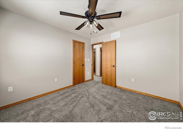 11837 County Road 39, Fort Lupton, CO 80621 - unfurnished bedroom with visible vents, baseboards, and carpet flooring