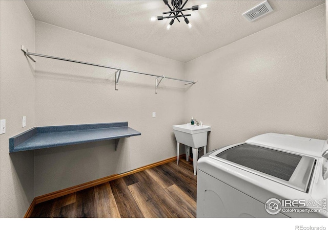 11837 County Road 39, Fort Lupton, CO 80621 - laundry area with baseboards, dark wood-type flooring, visible vents, laundry area, and washing machine and clothes dryer