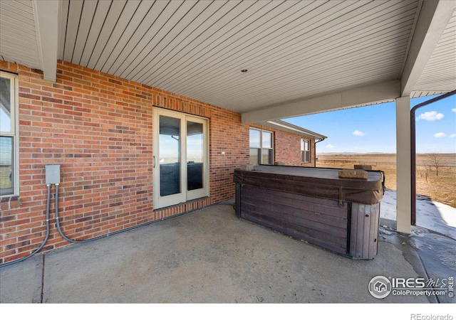 11837 County Road 39, Fort Lupton, CO 80621 - view of patio featuring a hot tub