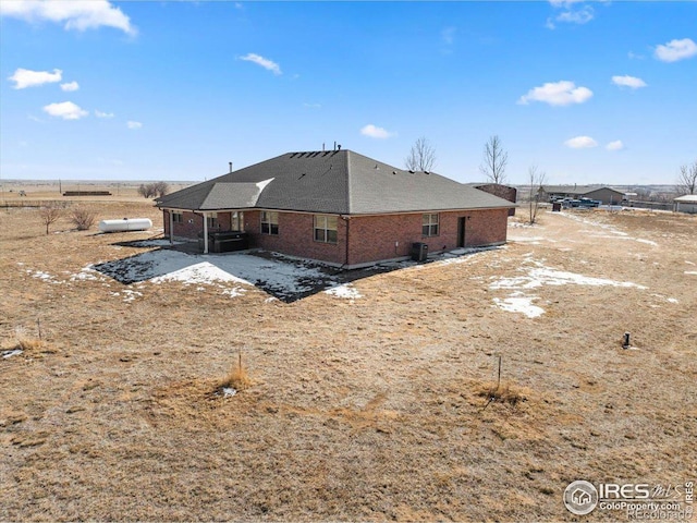 11837 County Road 39, Fort Lupton, CO 80621 - rear view of house with a shingled roof and brick siding