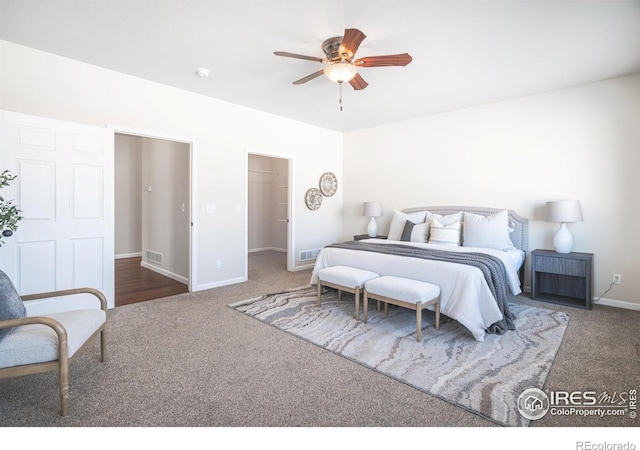 bedroom featuring baseboards, visible vents, and carpet flooring