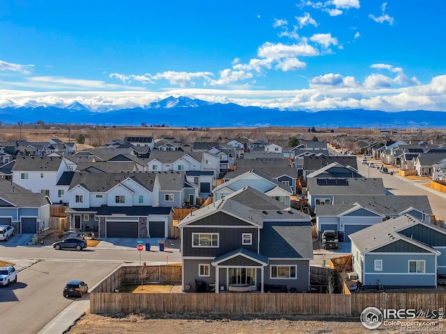 birds eye view of property with a residential view and a mountain view