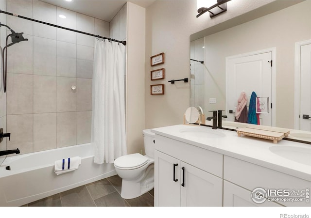 full bath featuring shower / bath combo, a sink, toilet, and double vanity