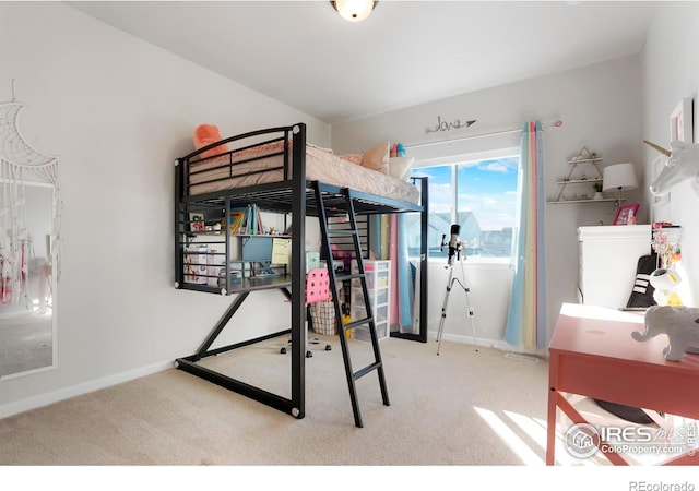 carpeted bedroom with baseboards