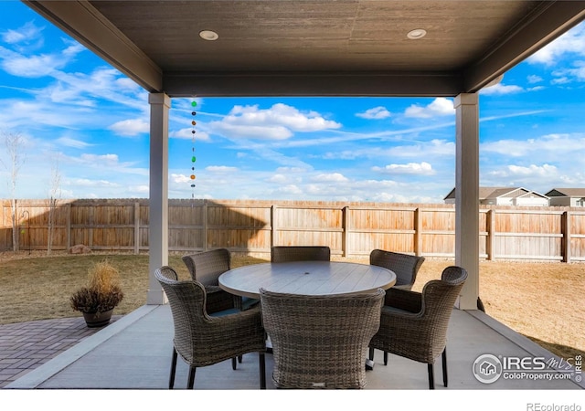 view of patio / terrace featuring outdoor dining area and a fenced backyard