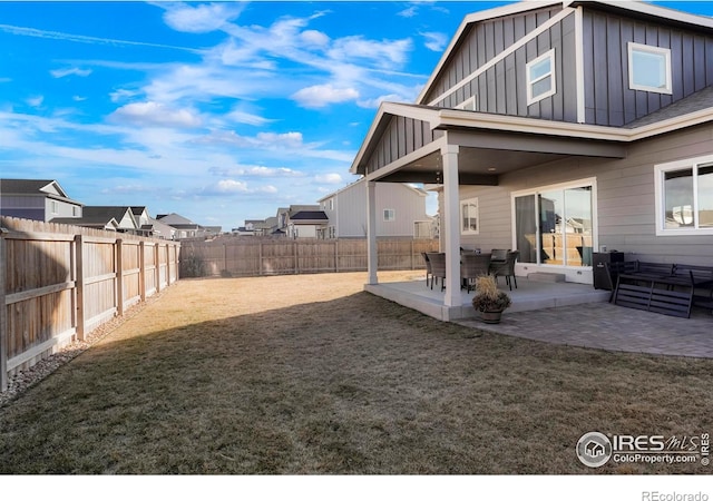 view of yard with a fenced backyard and a patio