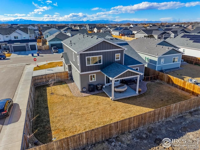 bird's eye view with a residential view and a mountain view