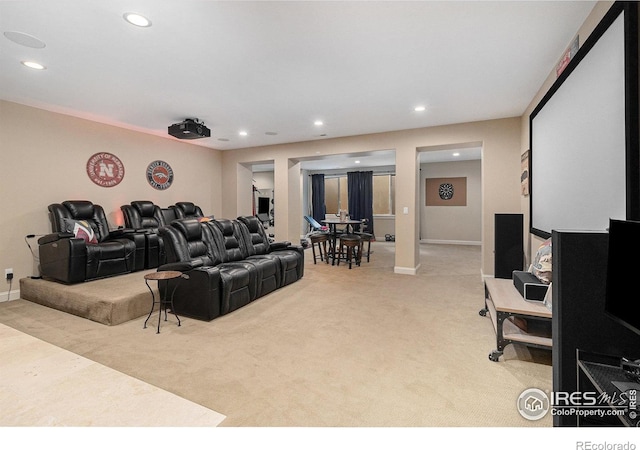 home theater room with light carpet, baseboards, and recessed lighting