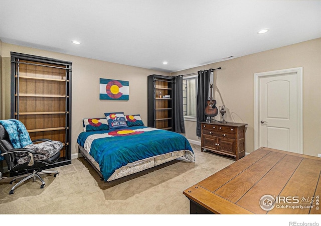 bedroom with recessed lighting and light colored carpet