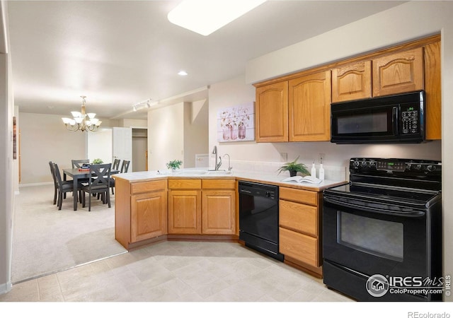 kitchen with light carpet, a peninsula, light countertops, black appliances, and a sink