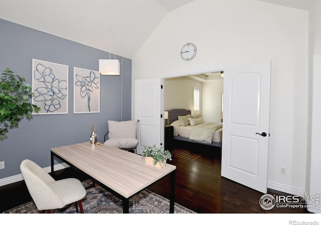 bedroom featuring high vaulted ceiling, dark wood-style flooring, and baseboards