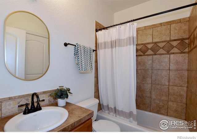 bathroom featuring toilet, shower / tub combo, and vanity