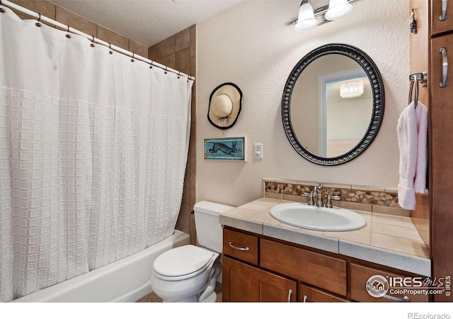 full bathroom featuring shower / bath combination with curtain, a textured wall, toilet, a textured ceiling, and vanity