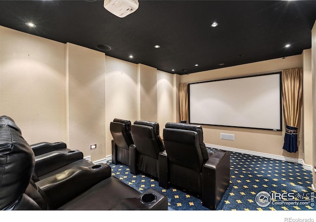 carpeted home theater with recessed lighting and baseboards